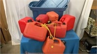 7 Gas cans and a storage tote