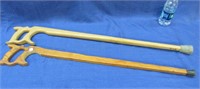 2 handcrafted "saw handle" walking canes