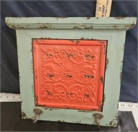 wall decor with pie safe tin in it