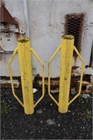 2 yellow steel post pounders; as is