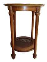 round wooden side table w caned shelf