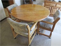 Round Oak Table with Six Rolling Chairs