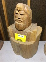 Mountain man carving from a log