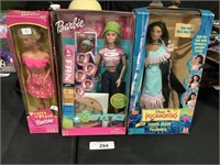2 Barbie Dolls, 1 Pocahontas Doll.