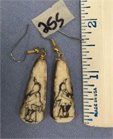 Pair of a 1 1/4" fossilized ivory earrings, scrimm