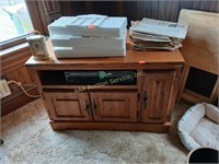 TV stand made of particle board in fair condition