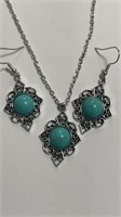 Matching turquoise earrings and pendant set.