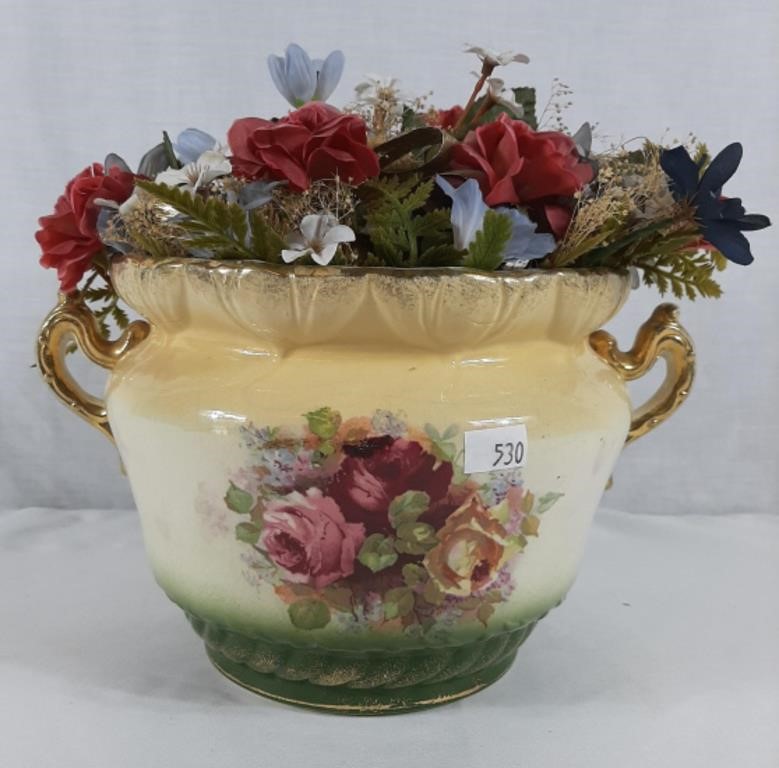 Wide mouth vase with artificial flowers