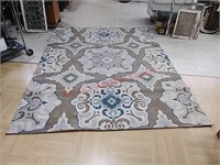 7'10" x 10' 5" area rug