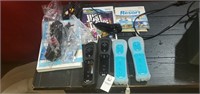 4 wii Controllers , and 3 Games