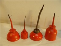 Four Red Oil Cans