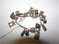 SILVER CHARM BRACLET-20 CHARMS-23.8 GR