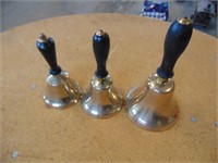 Set of three brass handbells