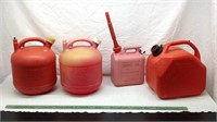 e5)   4 PLASTIC GAS CANS