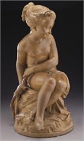 Terra cotta sculpture of a young maiden