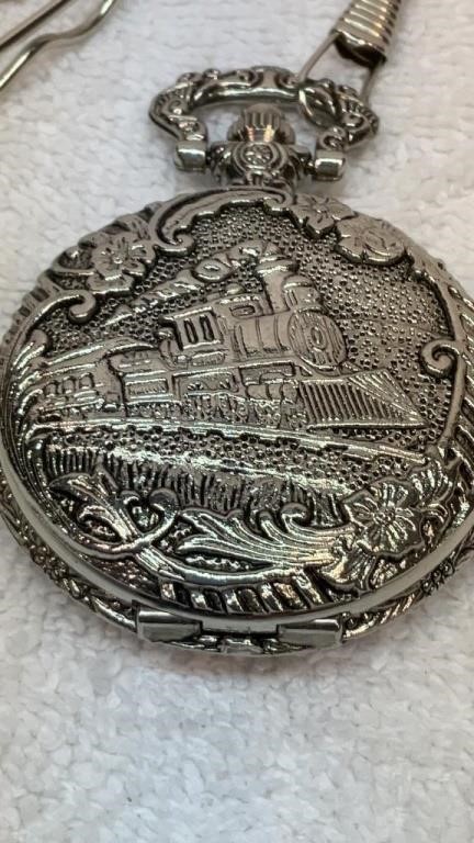 Engraved train pocket watch