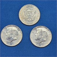 THREE 1964 UNCIRCULATED KENNEDY HALF DOLLARS