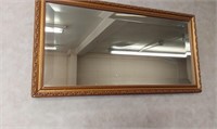 Vtg mirror w/gold toned frame. 25in x 13.5in.