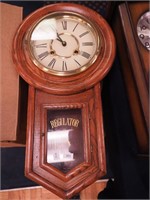 Striking Regulator oak wall clock marked with a