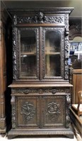 Louis XIII Style Cartouche Crowned Oak Bookcase.