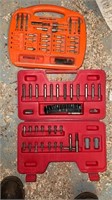 Two drill bit sets in cases