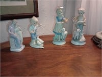 4 sweet porcelain figurines. One has a duck head