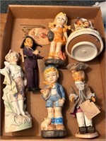 Music box and boys and girls statues