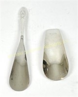 TWO STERLING SHOE HORNS