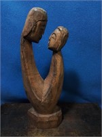 Woodcarved sculpture of couple 10 inches tall