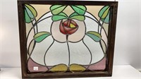 Antique stained glass in window, has hanging