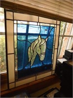 Two contemporary pieces of stained glass: one with