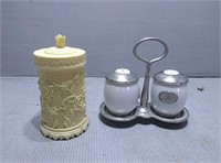 Salt and pepper shakers with holder and a plastic