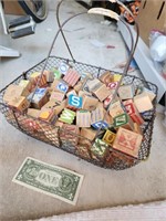Basket full of vintage wooden blocks, various size