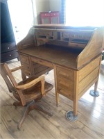Antique wooden doctors roll top desk with chair
