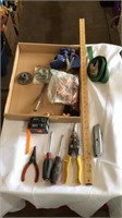 Box cutter, ratchet strap, switches, screwdrivers