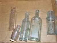 various antique small bottles