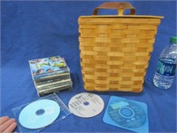 flip top basket with several music cd's