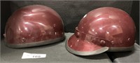 Pair of Vintage Burgundy Motorcycle Helmets.