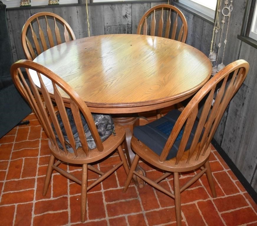 48" round oak pedestal table and 4 chairs; as is