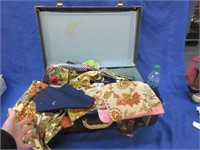 old suitcase with vintage fabrics