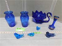 Blue glassware including vases, bird figurines, a