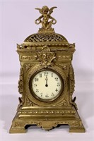 Mantle clock, Brass, cherub top, R & Co. made in
