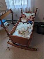 Child's Cradle With Dolls And Lamp Shade