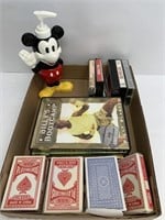 Playing cards besides work out DVDs and Mickey
