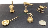 Miniature brass items include rocking horse,