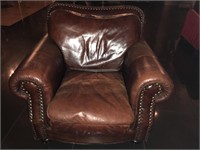 Executive leather armchair with embellishments.