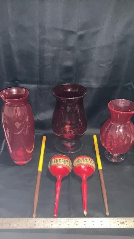 Red glass vases, drum sticks maracas