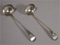 Pair of crested sterling silver sauce ladles