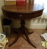 Drum table with drawer, metal feet are in drawer,