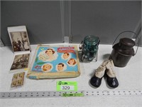 Jar with marbles; child's antique shoes; paper dol
